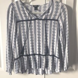 White and blue patterned blouse